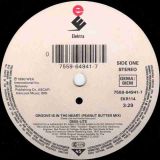 Deee-Lite – Groove Is In The Heart (Peanut Butter Mix) b/w What Is Love (Holographic Goatee Mix) – Elektra GER 7″