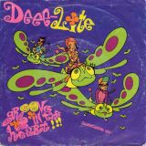 Deee-Lite – Groove Is In The Heart (Peanut Butter Mix) b/w What Is Love (Holographic Goatee Mix) – Elektra GER 7″