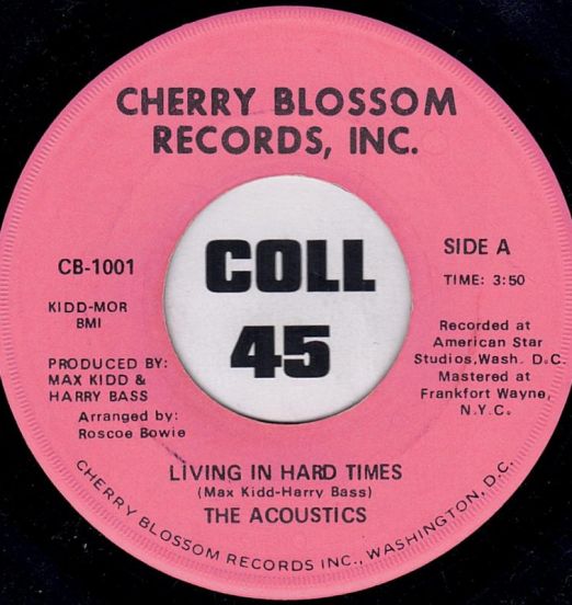 The Acoustics - Living In Hard Times b/w What Is The Name Of That Song - Cherry Blossom 7"