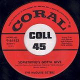 The McGuire Sisters – Something’s Gotta Give b/w Rhythm ‘N’ Blues – Coral 7″